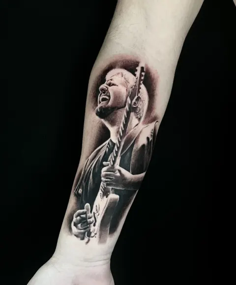 Ritratto tatuaggio Pino Daniele Lugano